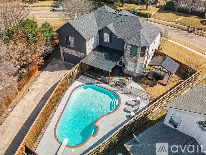 A house with a pool in the backyard.