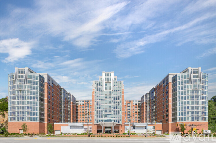 A large building complex with multiple glass-fronted buildings.
