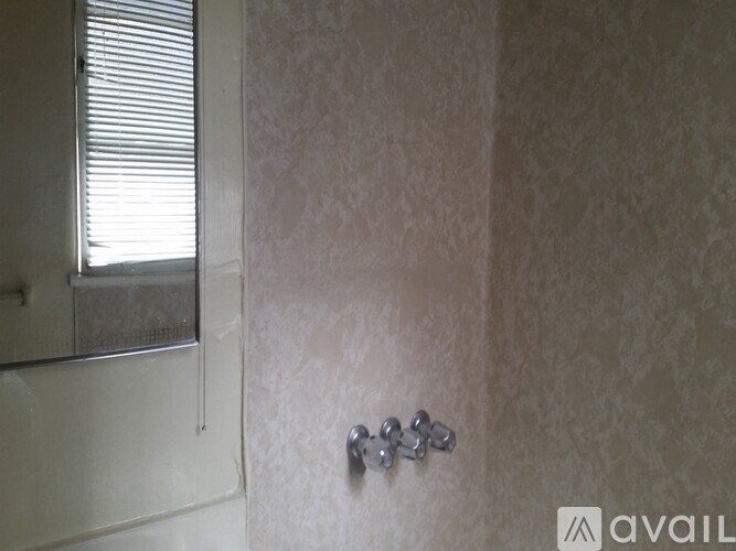 A wall with a small cluster of buttons on it.