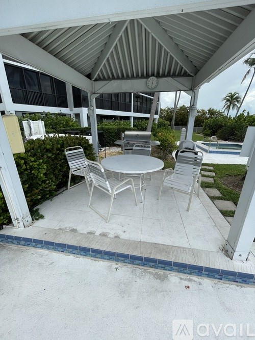 A patio with a table and chairs is shown.
