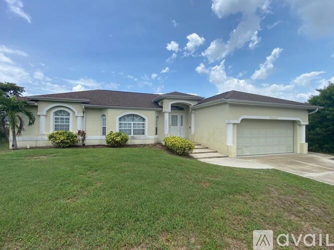 A house with a brown roof and a white garage door.