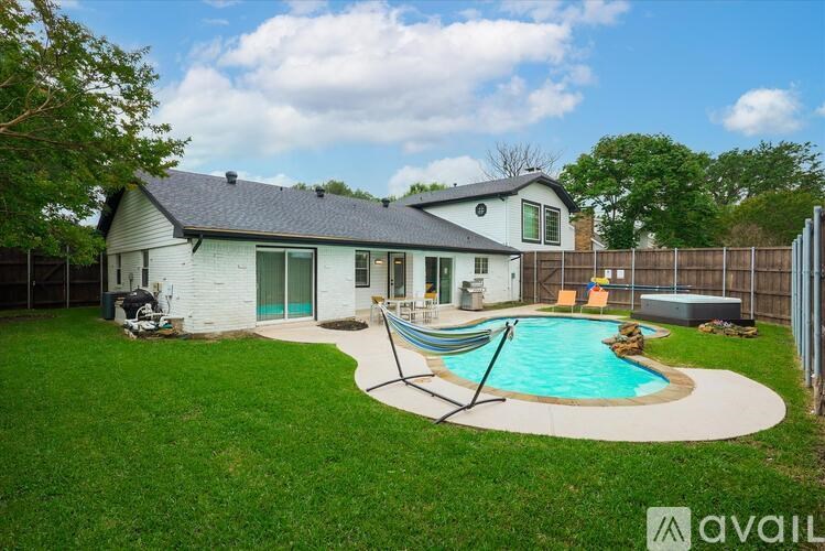 A house with a pool in the backyard.