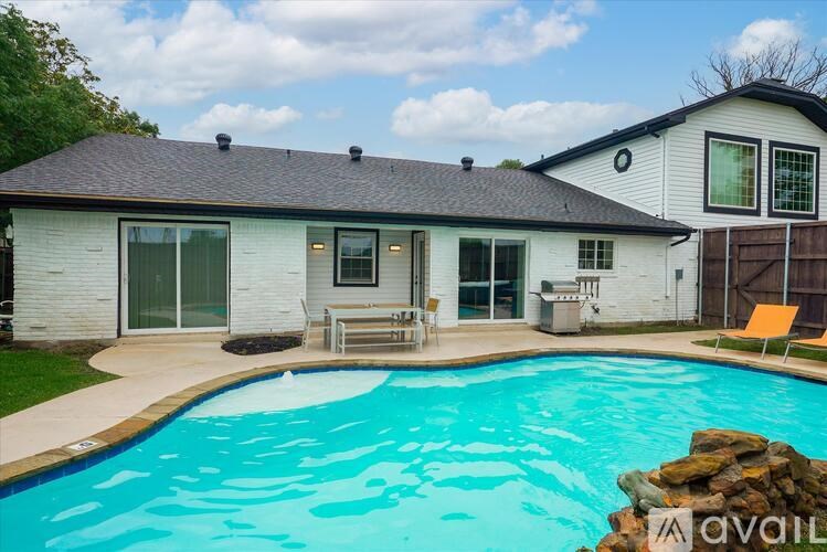 A house with a pool in the backyard.