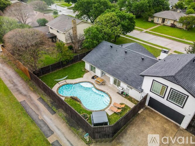 A house with a pool in the backyard.