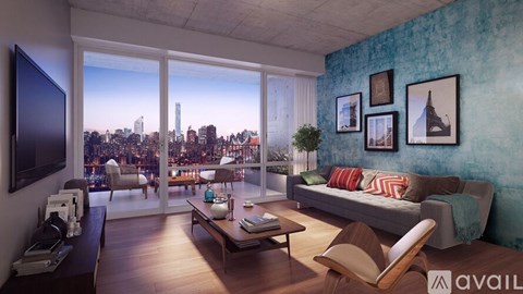 A living room with a view of the city skyline.