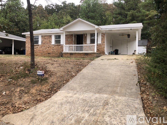 A house with a driveway in front of it.
