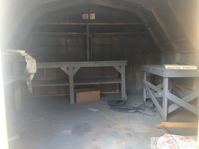 A construction site with a table and a bench.