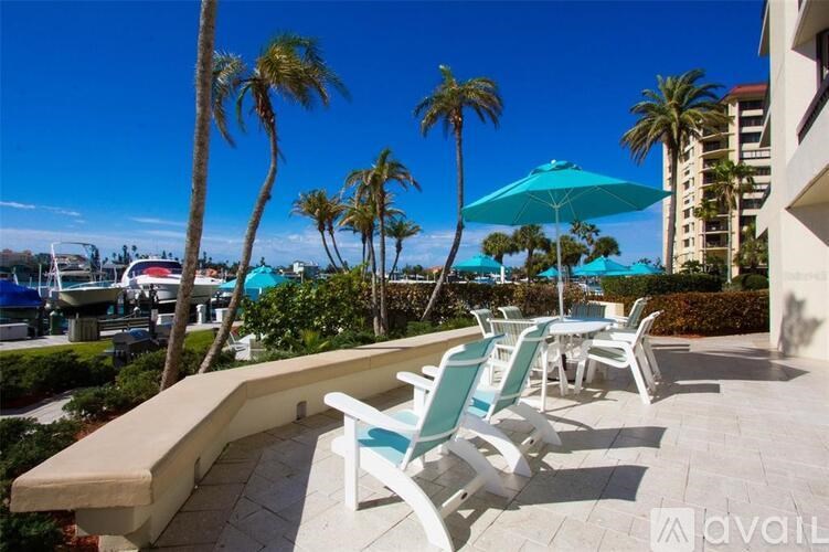 A patio with chairs and a table is available for rent.