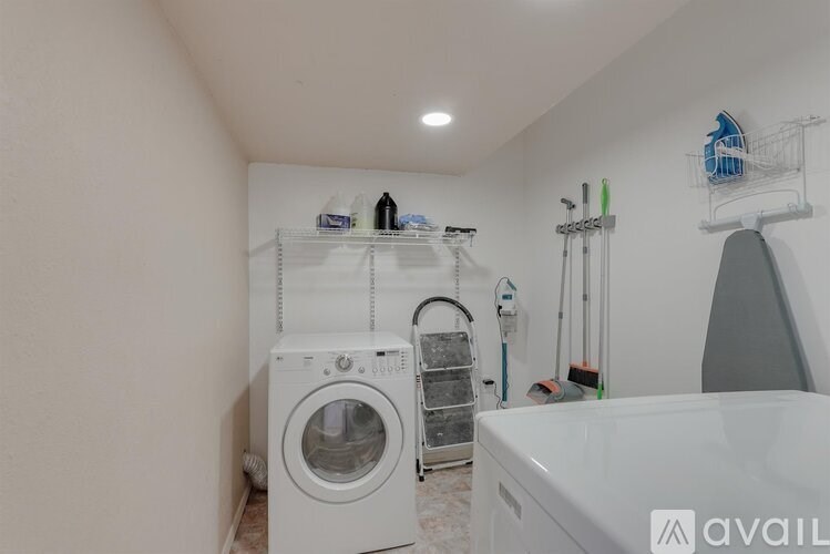 A laundry room with a washing machine and a dryer.