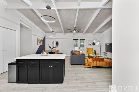 A kitchen with a stainless steel refrigerator and a stove top oven.
