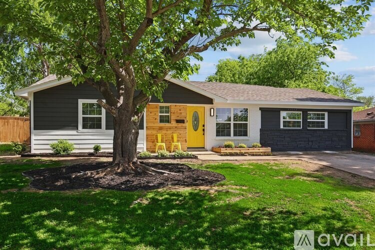 A house with a yellow door is for sale.