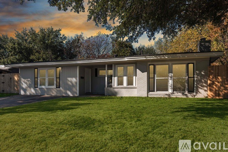 A house with a lawn in front of it.