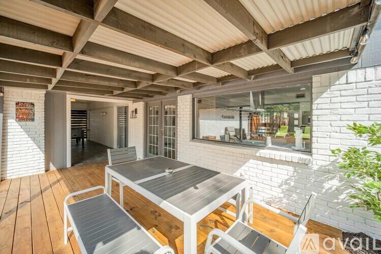 A patio with a table and chairs is available for rent.