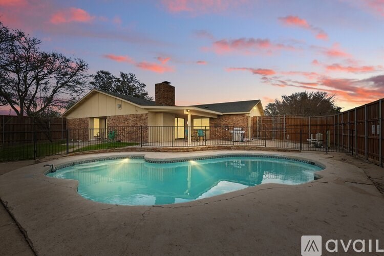 A house with a pool in the backyard.