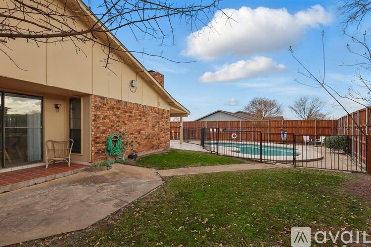 A house with a pool in the backyard.