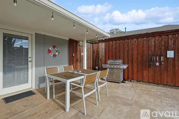 A patio with a table and chairs is available for rent.