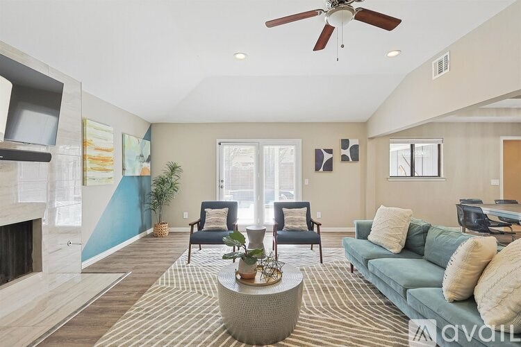 A living room with a fireplace and a couch.