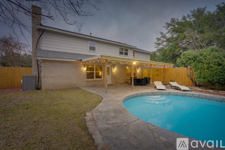 A house with a pool in the backyard.