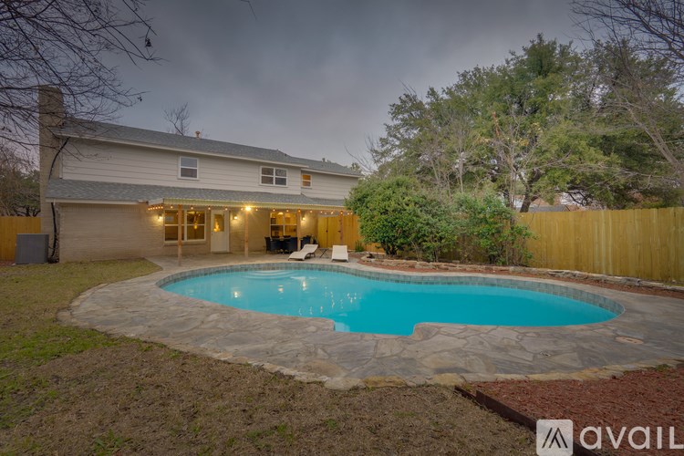 A house with a pool in the backyard.