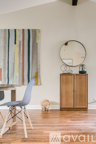 A chair is placed in front of a dining table.