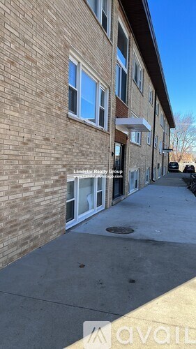 A building with a sign that says "Liberty Realty Group" on it.