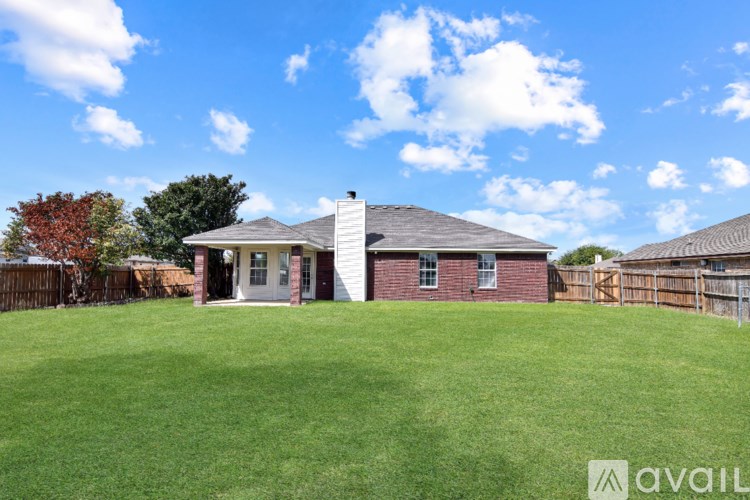 A house with a large yard is for sale.