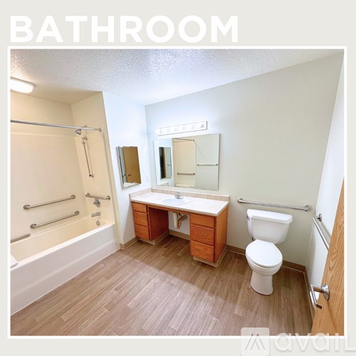 A bathroom with a toilet, sink, and bathtub.
