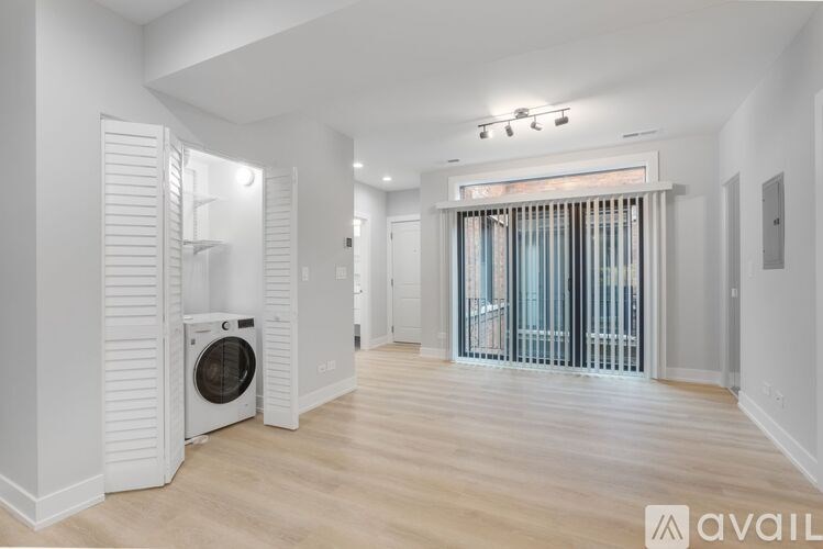 A modern laundry room with a washer and dryer.