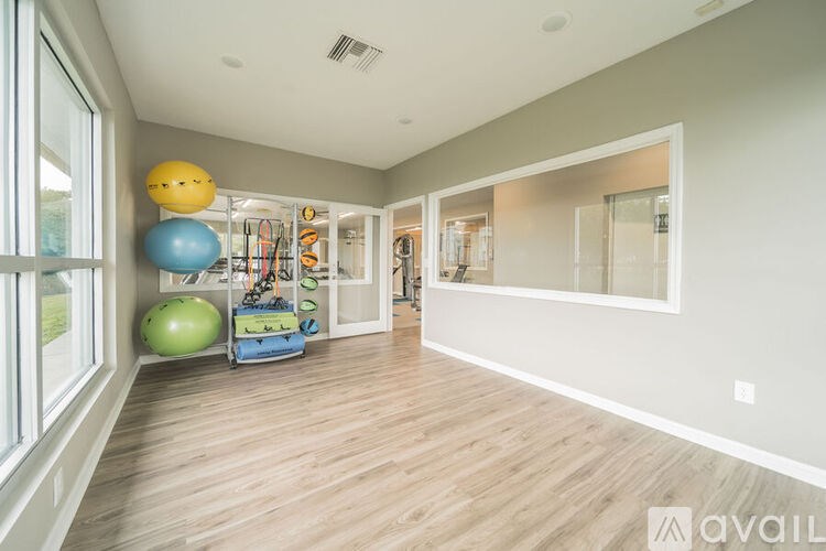 A room with exercise equipment and a window.