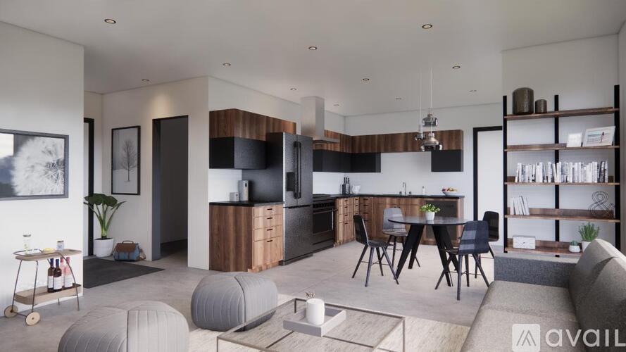 A modern kitchen with a dining table and chairs.