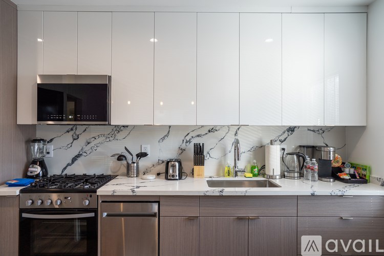 A kitchen with a stove, oven, and a microwave above the stove.