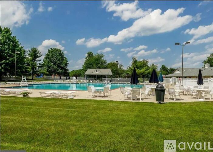 A pool area with loungers and umbrellas is available.