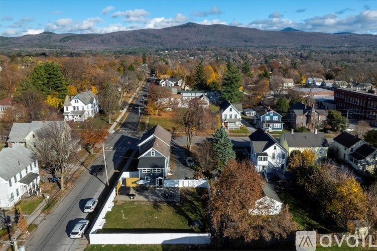 A small town with a mix of residential and commercial buildings.