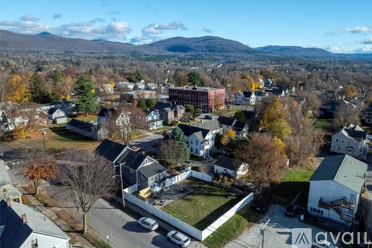 A small town with a mountain in the background.