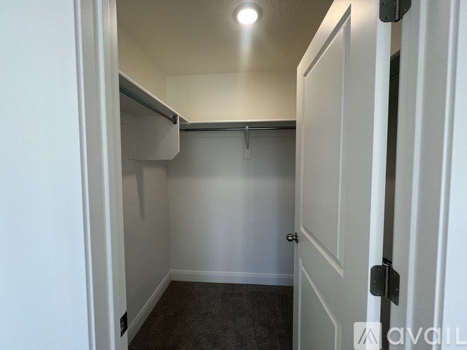 A small, empty room with a door on the right.