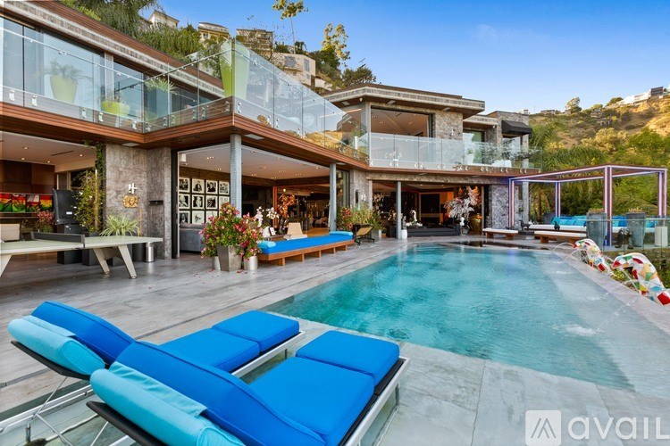 A modern house with a pool in the backyard.