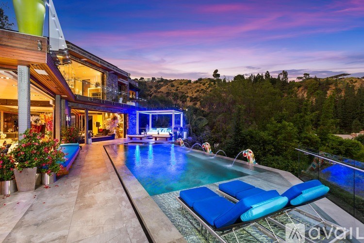 A modern house with a pool in the backyard.