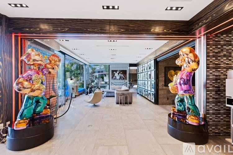 A room with a wooden ceiling and a glass wall with a cartoon character on it.