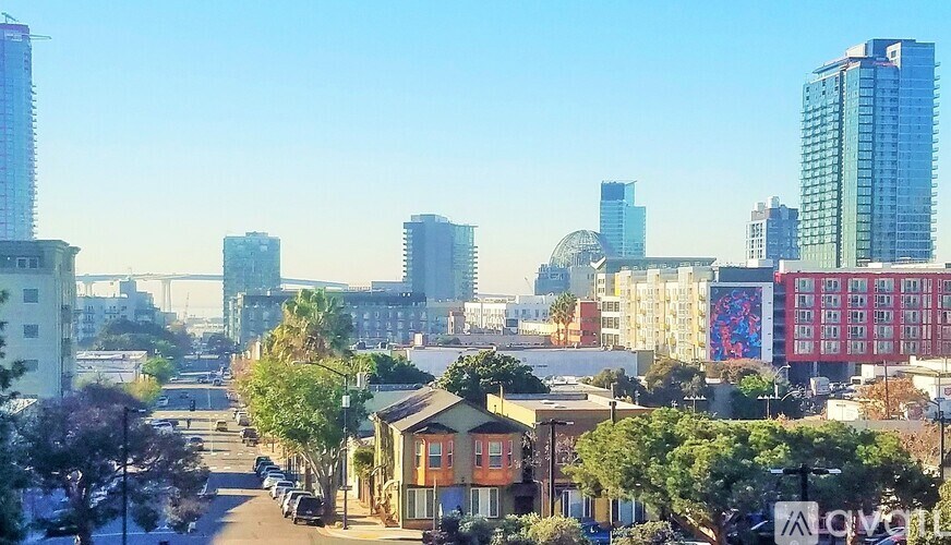A cityscape with buildings and a clear sky.