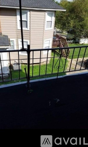 A black metal fence in front of a house.