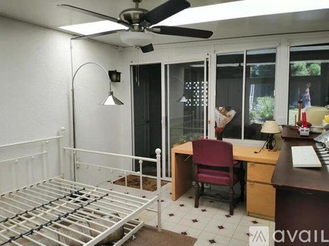 A bathroom with a sink, toilet, and shower.