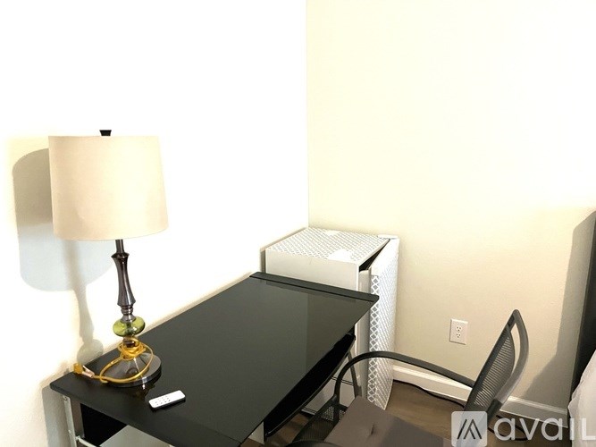 A table with a lamp on it.