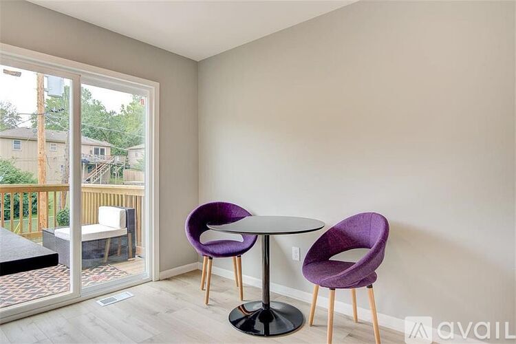 A room with a table and two chairs in it.