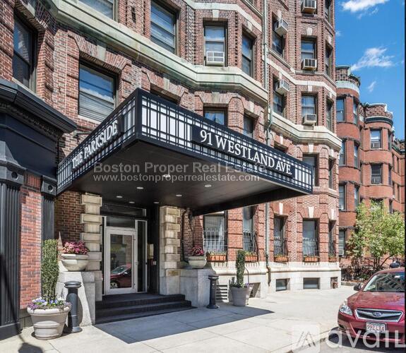 The entrance to a building with a sign that reads "91 Westland Ave.".