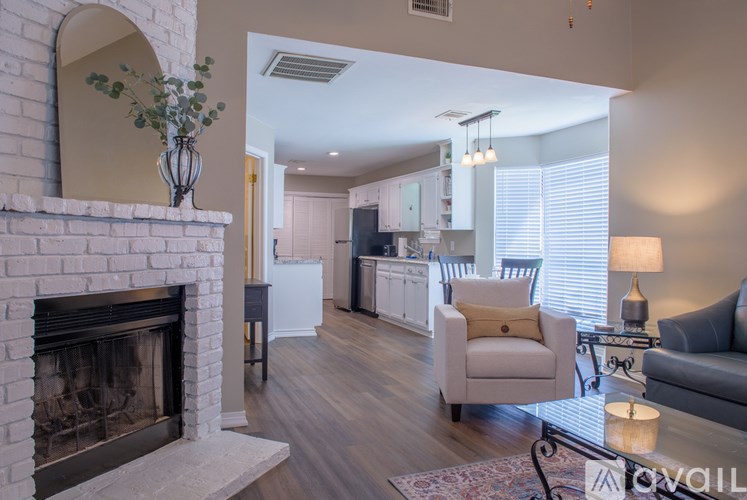 A living room with a fireplace and a couch.