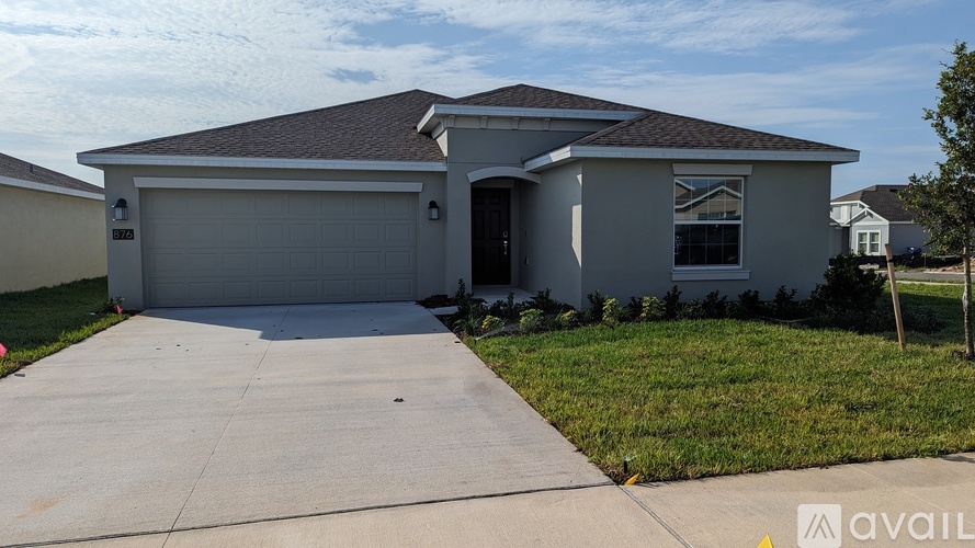 A house with a garage is available for sale.