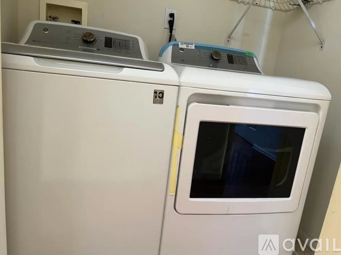 A white oven with a blue sticker on the door.