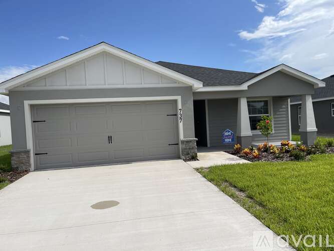 A two-car garage is attached to a house.