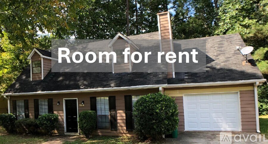 A house with a sign that says "Room for rent" is available for rent.