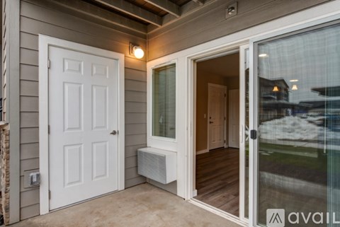 A white door is on the left and a glass door is on the right.